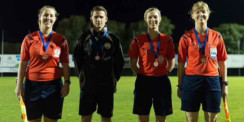 BRISBANE, AUSTRALIA - SEPTEMBER 12: The match officials pose for a photo after the PlayStation 4 National Premier League Women's Grand Final between The Gap and Palm Beach at Corporate Travel Management Stadium on September 12, 2015 in Brisbane, Australia. (Photo by Albert Perez)